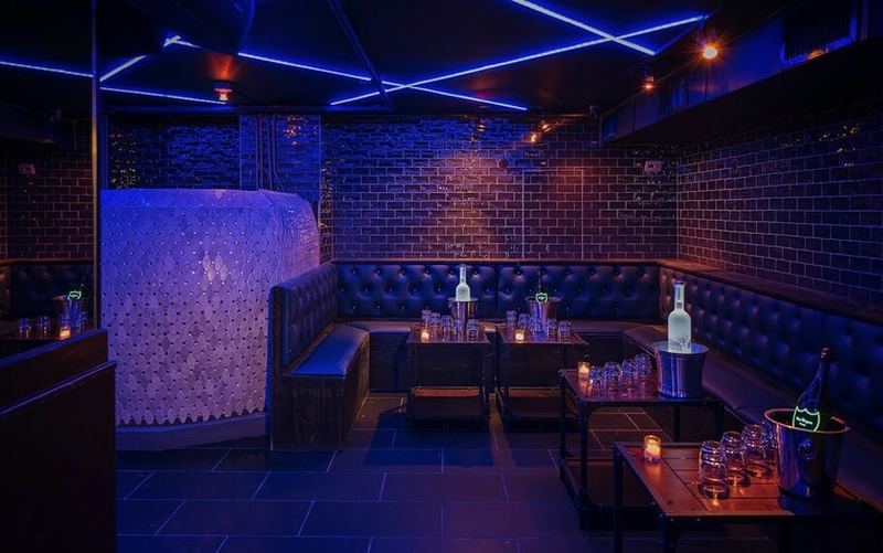 Leather banquettes beside the egg DJ booth