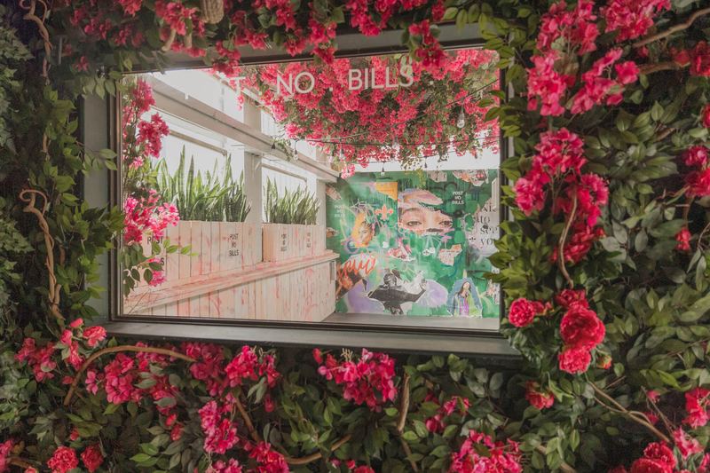 Flower-framed mirror and mural on the rooftop