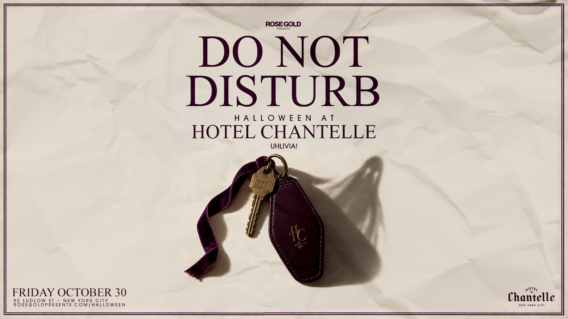 Do Not Disturb: Halloween at Hotel Chantelle. A brass room key numbered 777 on a plum leather tag, casting a ghost-shaped shadow.