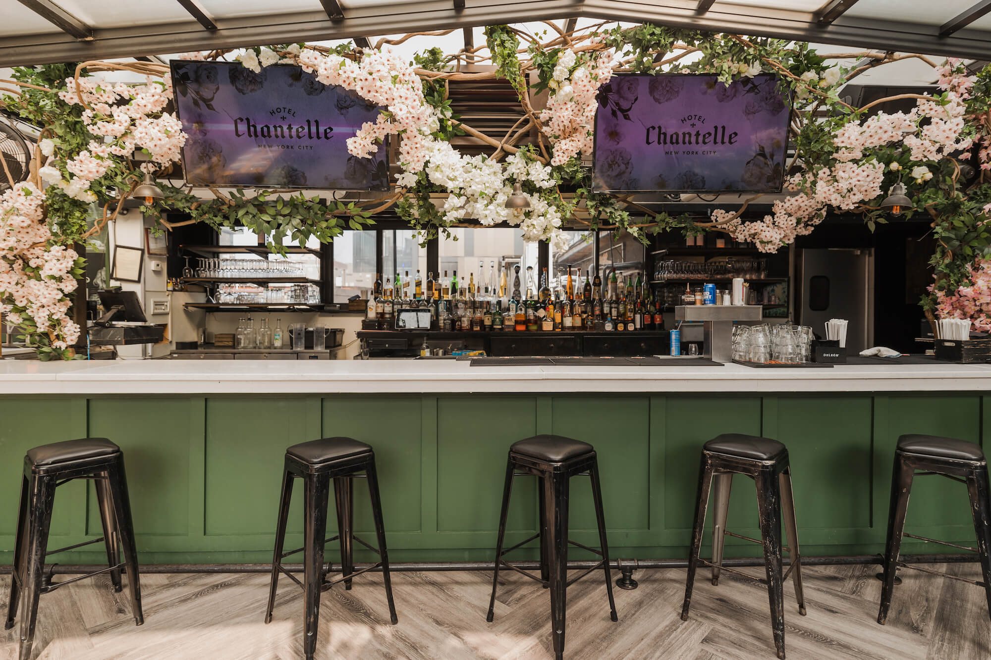The rooftop bar under a canopy of flowers