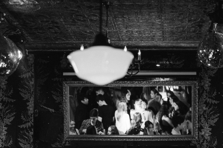 Vintage mirror reflecting the crowd